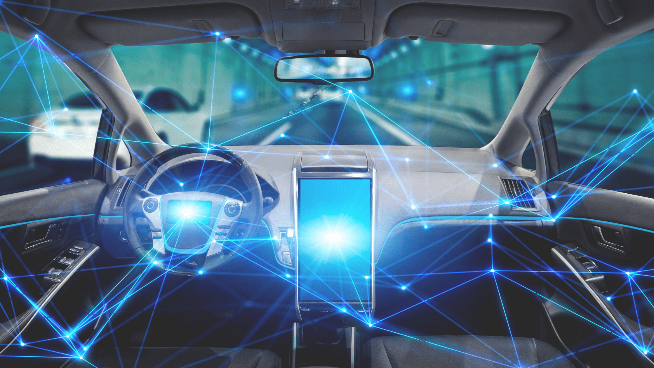car cockpit showing steering wheel and screen with bright blue lights