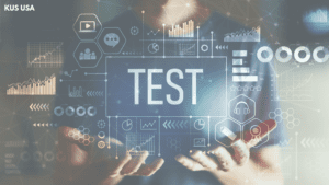 hand holding up images of graphs and the word test